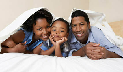 African family on the bed